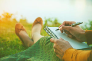 Creative Women are ready to write with pen and notebook in hand